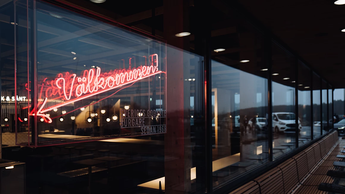 Sustainability illustration on background imagee, a dark forrest. Illustration of people, earth and a plate with cutlery and a heart in a circle.